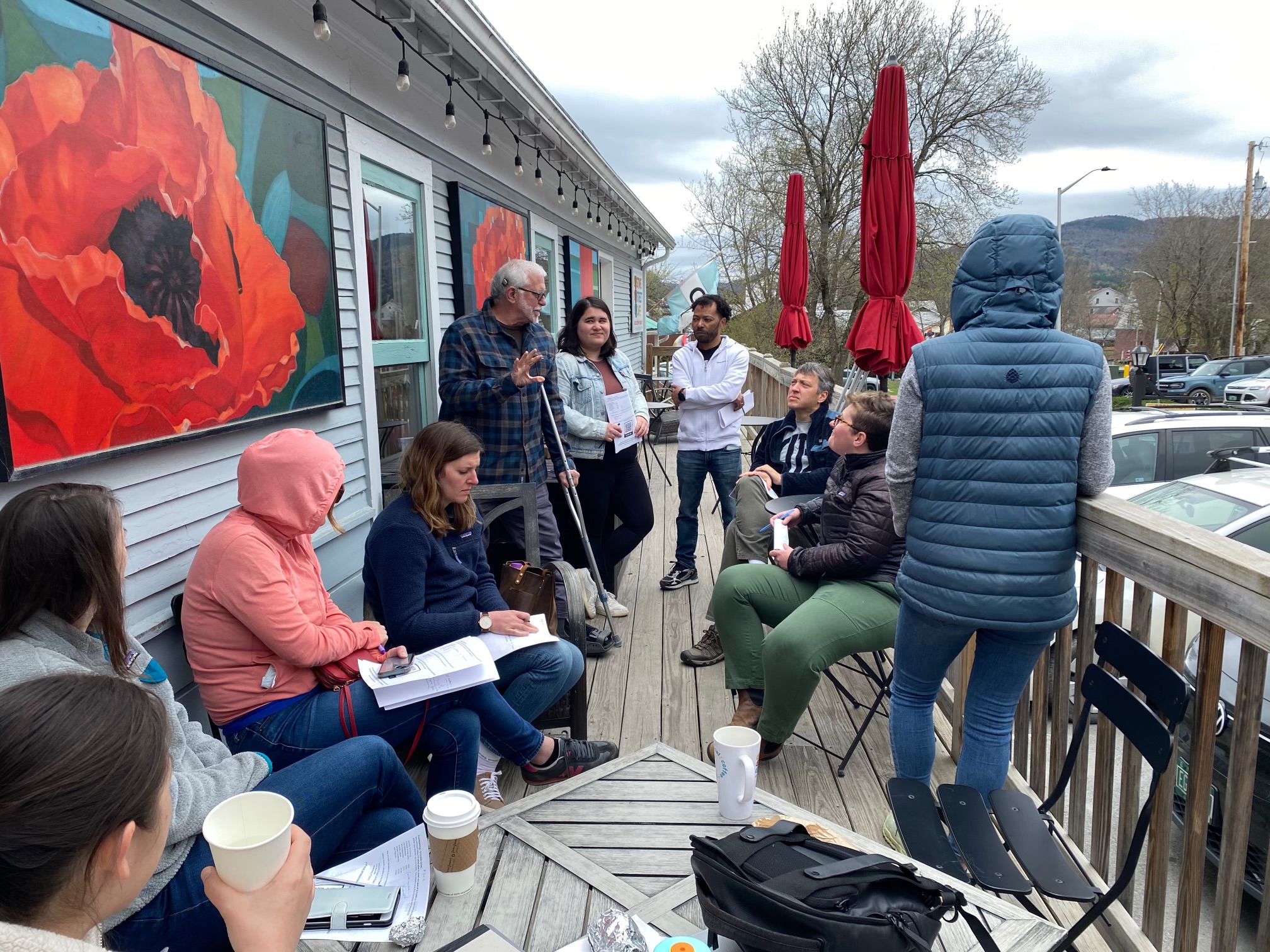 A group of WAARC members meeting on the deck at Stowe Street Cafe in downtown Waterbury, VT